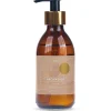 Naturalna Aromabaza do masażu Klaudyna HEBDA w brązowej butelce z pompką, idealna jako aromaterapeutyczna baza zapachowa.