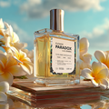 Prostokątna butelka luksusowego suchego olejku Flower Paradox 100 ml by K. Hebda w otoczeniu jasnych, kwitnących kwiatów.